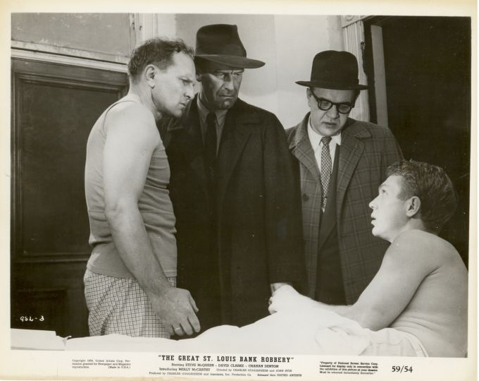 Steve McQueen as 'George Fowler' is confronted by his fellow conspirators